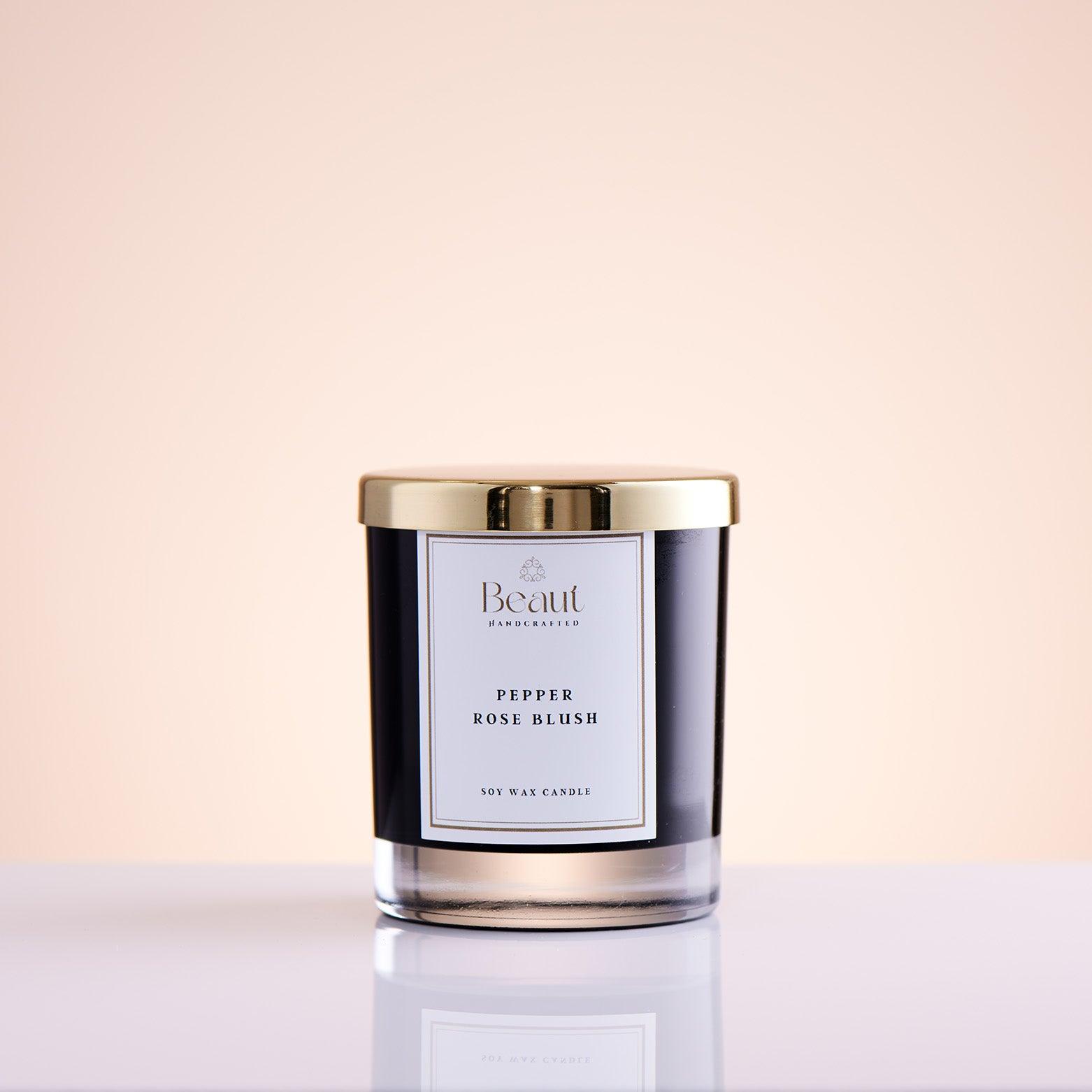 Pepper Rose Blush Soy Candle in the glass container