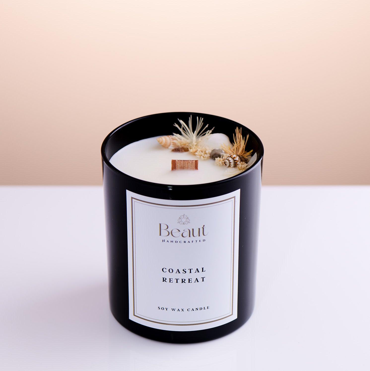 soy wax hand made and decorated candle side view, decorated with seashells