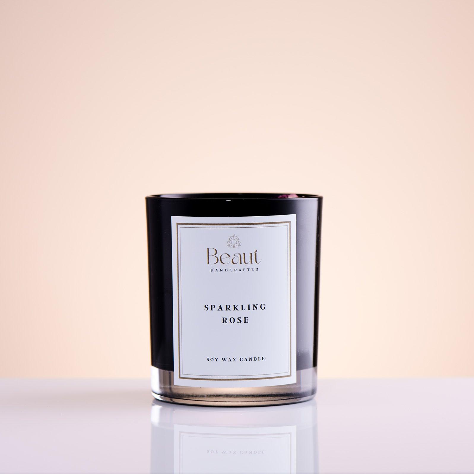 the image show candle made by hands using soy wax candle and hand made decorations on wax made from dried roses, candle using wooden wick that is crackling when lit