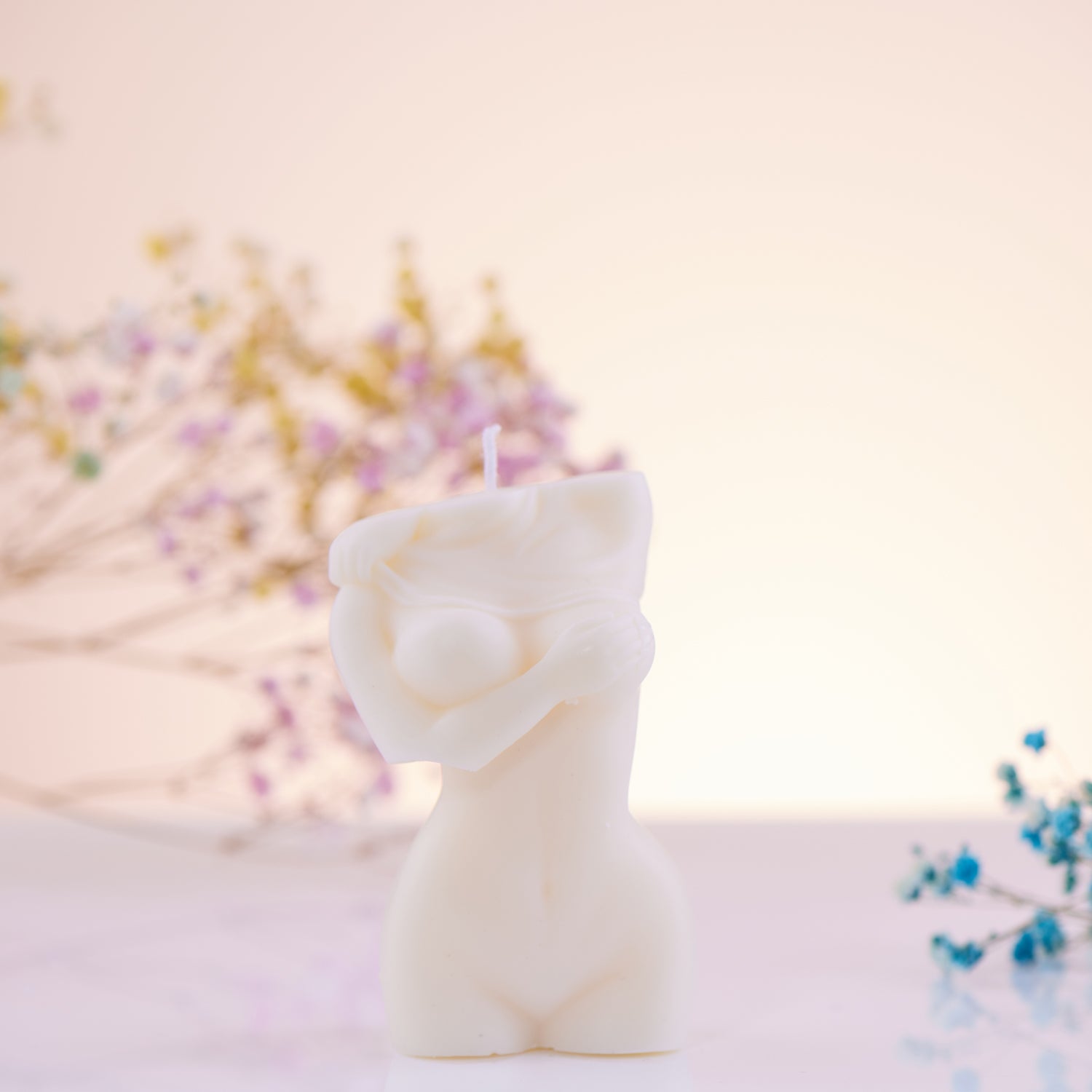 Female Body Holding Breast Candle