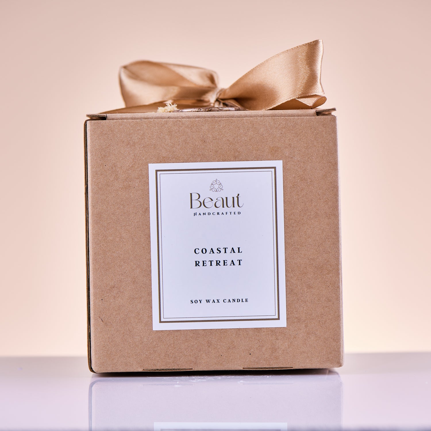 soy wax hand made and decorated candle side view, decorated with seashells